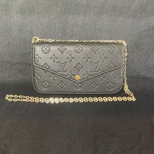 Black and Gold Monogram Clutch
Luxury Inpaired